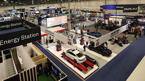 ALT Text: Show floor at CES with all the automotives named vehicle tech