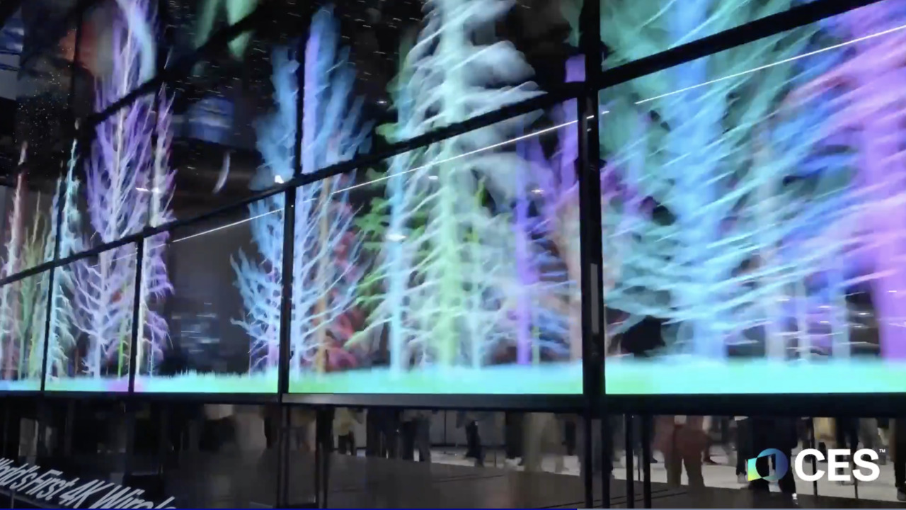 ALT Text: 14 tv monitors all creating a big image simultaneously 