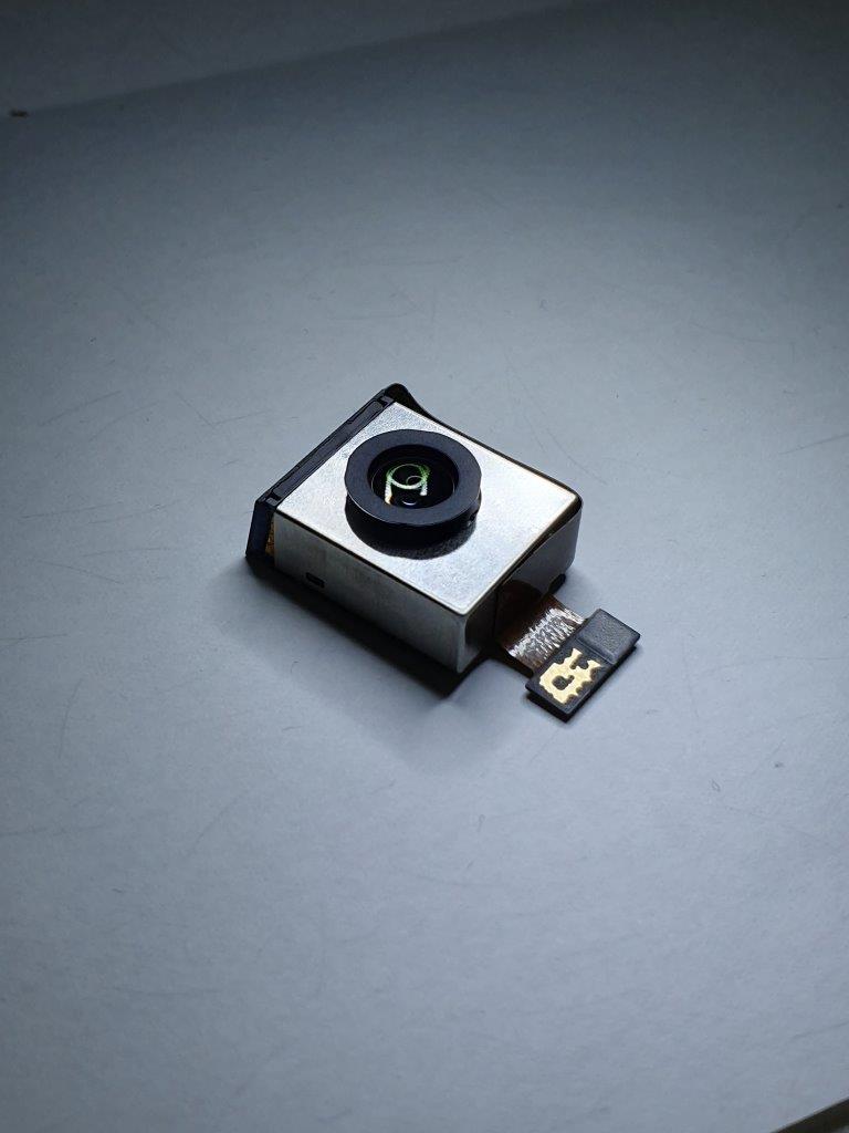 All Lenses on Prism: Compact camera module with a prism-based lens system.